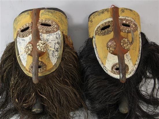 Two similar Sepik River ceremonial masks